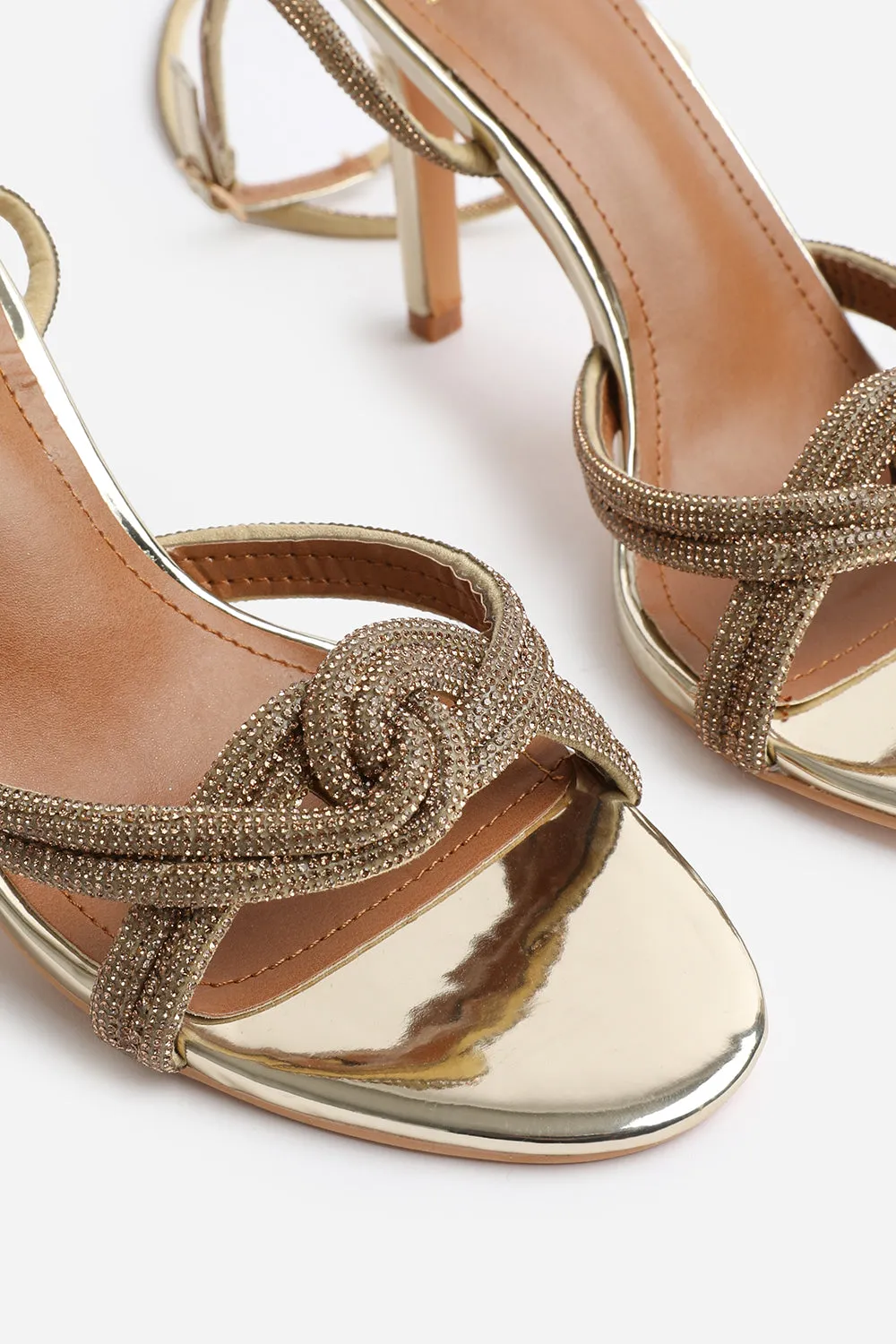 MADON DIAMANTE KNOT DETAIL WITH CROSS OVER ANKLE STRAP HIGH HEELS IN GOLD CHROME